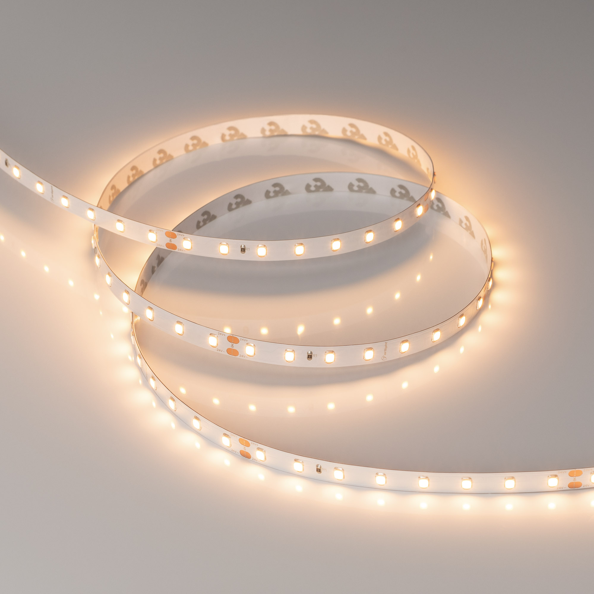 Светодиодная лента Arlight 6W/m 80Led/m 2835 Warm3000 8mm 24V 5M IP20 024513(2)